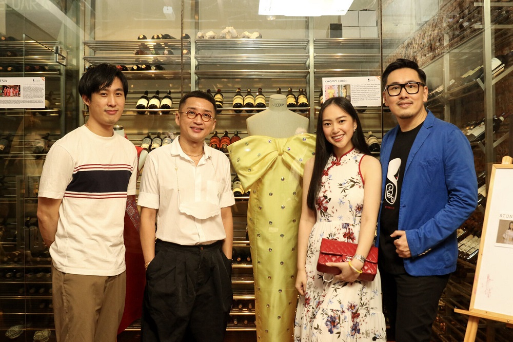 Designer Khoon Hooi (second left) with the 8sian team alongside the physical Khoon Hooi Mara gown worn by Katy Perry. ― Picture courtesy of 8sian