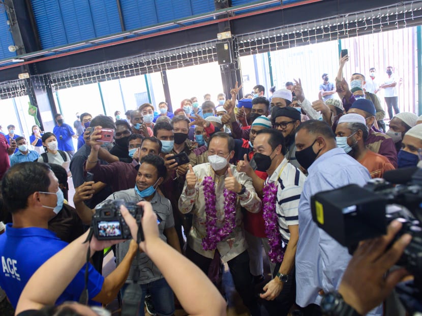 Migrant workers taking a welfie with Manpower Minister Tan See Leng (with thumbs up) and Senior Minister of State for Manpower Koh Poh Koon at the Hari Raya celebration at Tuas South Recreation Centre on May 3, 2022. u00e2u20acu2022 Picture courtesy of Ministry of Ma
