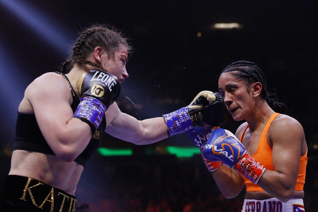 Katie Taylor of Ireland (black trunks) trades punches with Amanda Serrano of Puerto Rico (white trunks) for the World Lightweight Title fight at Madison Square Garden on April 30, 2022 in New York, New York. u00e2u20acu201d Getty Images via AFP