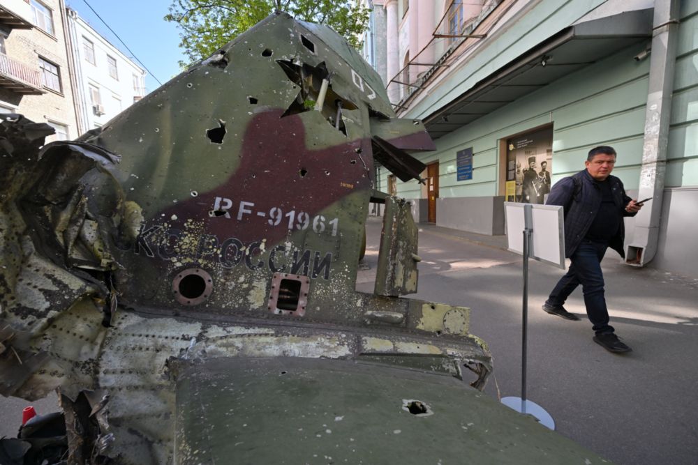A pedestrian walks past the wreckage of a Russian plane outside the National Museum of Military History of Ukraine in Kyiv on May 5, 2022. u00e2u20acu201d AFP pic