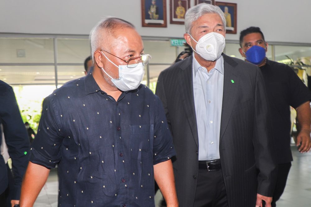 Datuk Seri Ahmad Zahid Hamidi (right) arrives at the Shah Alam Court May 10, 2022. u00e2u20acu201d Picture by Miera Zulyana