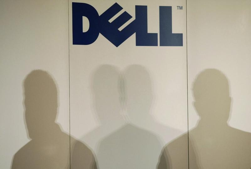 Shadows of Michael Dell, chairman of the board and chief executive officer of Dell, are cast under the company logo as he speaks during a press briefing in Tokyo March 24, 2009. u00e2u20acu201d Reuters pic