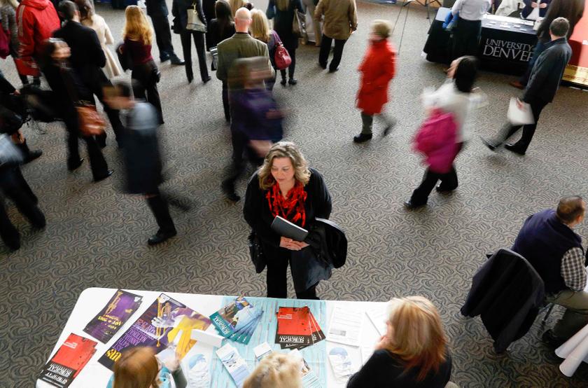 A job seeker talks to an exhibitor at the Colorado Hospital Association health care career fair in Denver in this file photo from April 9, 2013. u00e2u20acu201d Reuters pic