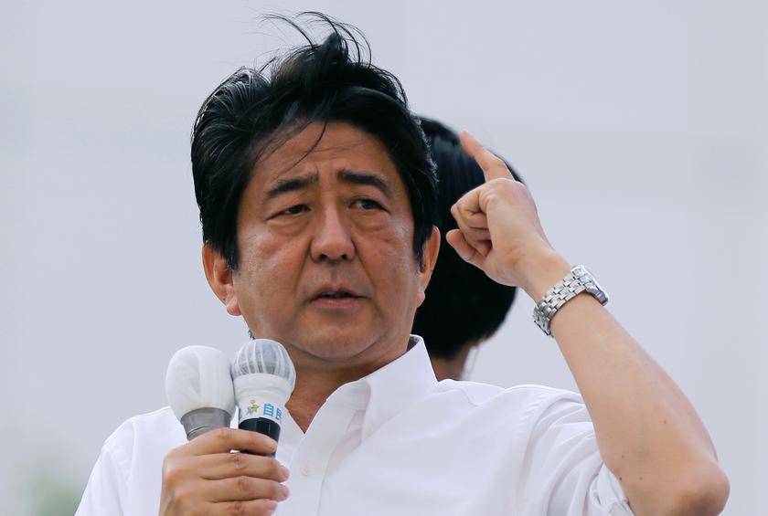 Japan's Prime Minister Shinzo Abe, and the leader of the ruling Liberal Democratic Party (LDP), speaks to voters atop a van while campaigning for the July 21 Upper house election in Tokyo July 20, 2013. u00e2u20acu201d Reuters pic