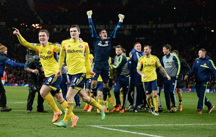 Sunderland's Craig Gardner (left) and Adam Johnson celebrate after winning their penalty shootout against Manchester United in their English League Cup semi-final second leg football match at Old Trafford, northern England, January 22, 2014. u00e2u20acu201d Reuters p
