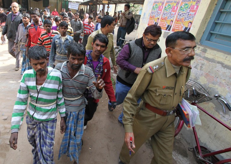 Suspects in a gang-rape case are led by police to a district courthouse in Birdhum district near the village of Subalpur, some 240 kilometres west of Kolkata, on January 23, 2014. u00e2u20acu201dAFP pic