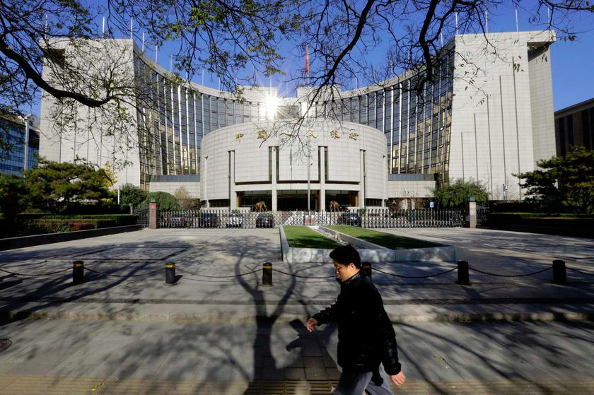 A man walks past the headquarters of the People's Bank of China (PBOC), the central bank, in Beijing November 20, 2013. u00e2u20acu201d Reuters pic