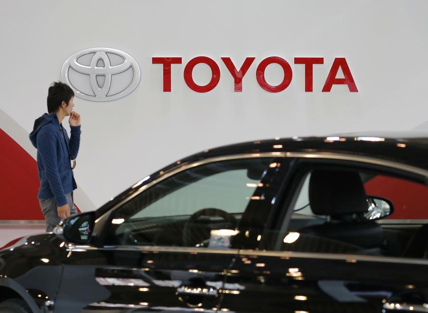 A man walks past Toyota Motor's logo at the company's showroom in Tokyo November 6, 2013. u00e2u20acu201d Reuters pic