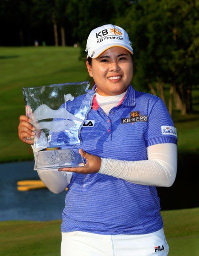 Inbee Park of South Korea poses with the trophy after winning the Walmart NW Arkansas Championship Presented by P&G on June 23, 2013 in Rogers, Arkansas. u00e2u20acu201d AFP pic