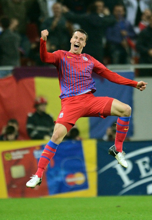 Picture taken on October 25, 2012 shows Vlad Chiriches of Steaua Bucharest celebrating scoring during the UEFA Europa League Group E football match FC Steaua Bucaresti vs Molde FK in Bucharest, Romania. u00e2u20acu201d AFP pic