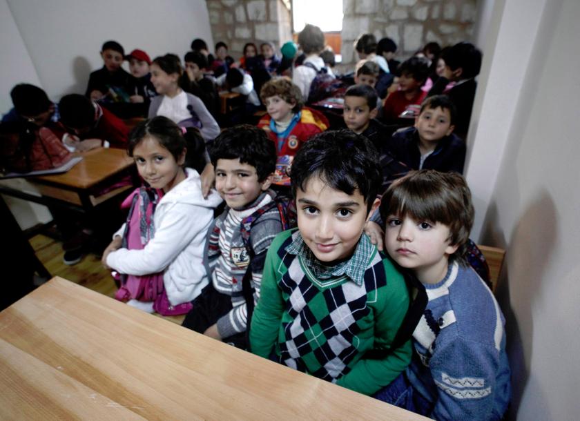 Syrian refugee children attend class at a school for refugee children in Istanbul. — Reuters  pic