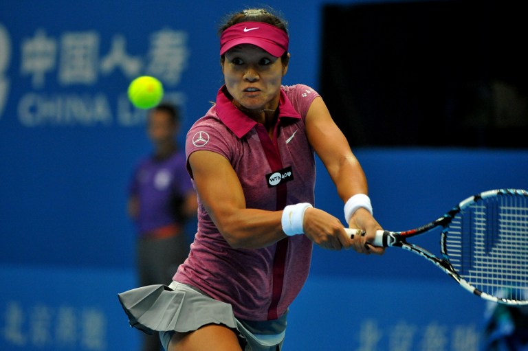 Li Na of China hits a return against Daniela Hantuchova of Slovakia during their women's singles match at the China Open tennis tournament in Beijing on September 29, 2013. u00e2u20acu201d AFP pic