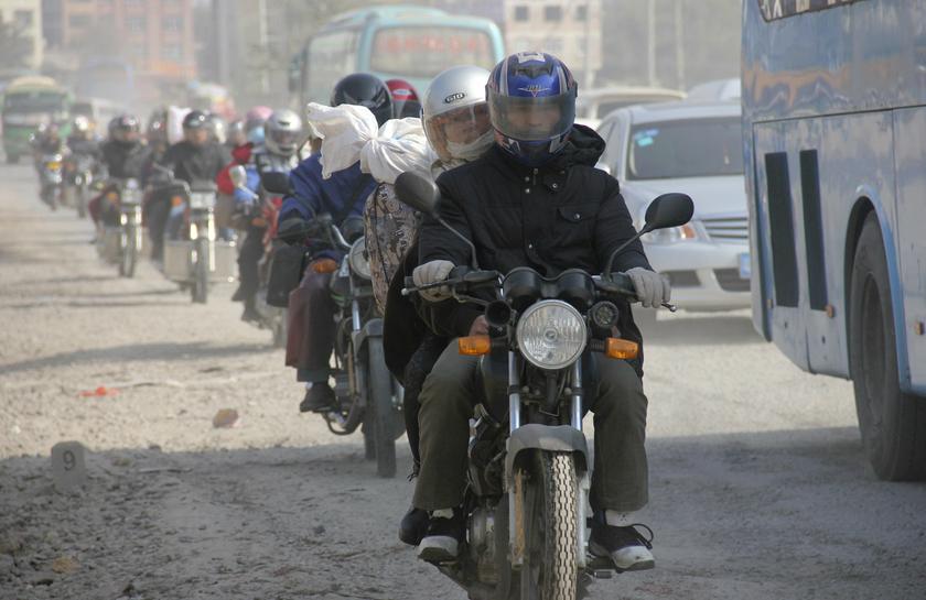 Migrant workers ride motorcycles with their belongings as they make their way home for the Spring Festival, in Wuzhou, Guangxi province January 21, 2014. u00e2u20acu201d Reuters pic