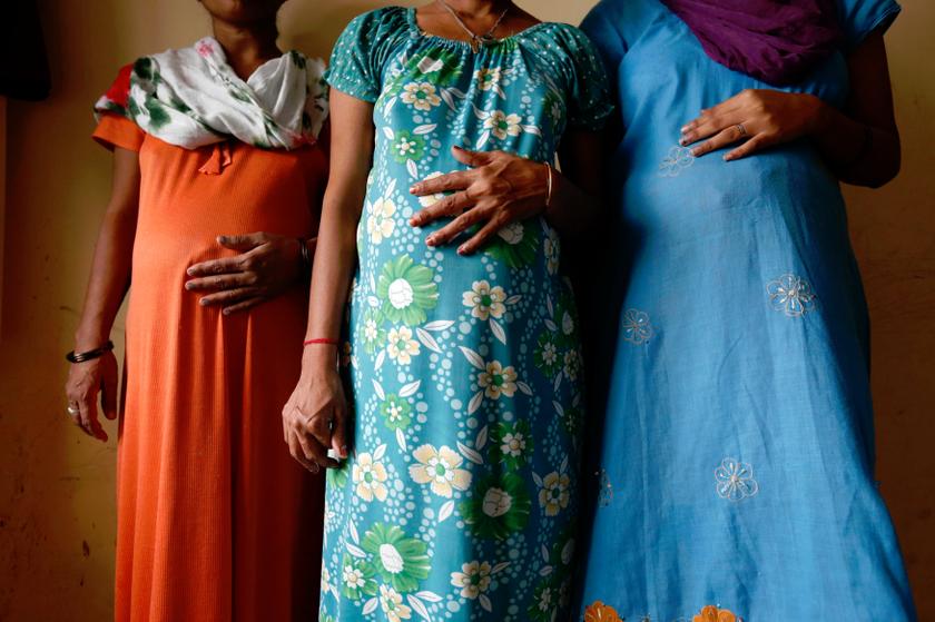 Surrogate mothers (left to right) Daksha, 37, Renuka, 23, and Rajia, 39, pose for a photo inside a temporary home provided by Akanksha IVF centre in Anand town, about 70 km south of the Indian city of Ahmedabad August 27, 2013. u00e2u20acu201d Reuters pic
