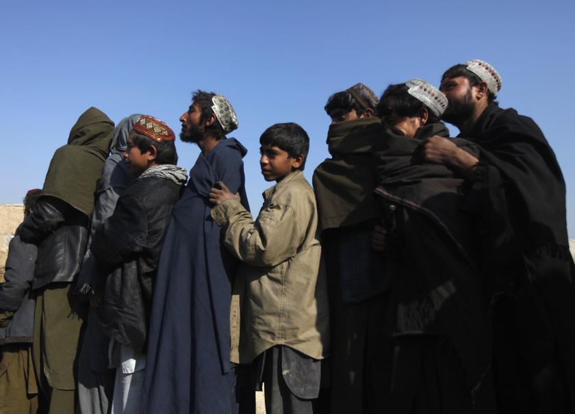 Afghan men line up to receive winter aid, donated by Muslim Hands, a UK-registered international aid organization, in Kabul January 5, 2014. u00e2u20acu201d Reuters pic
