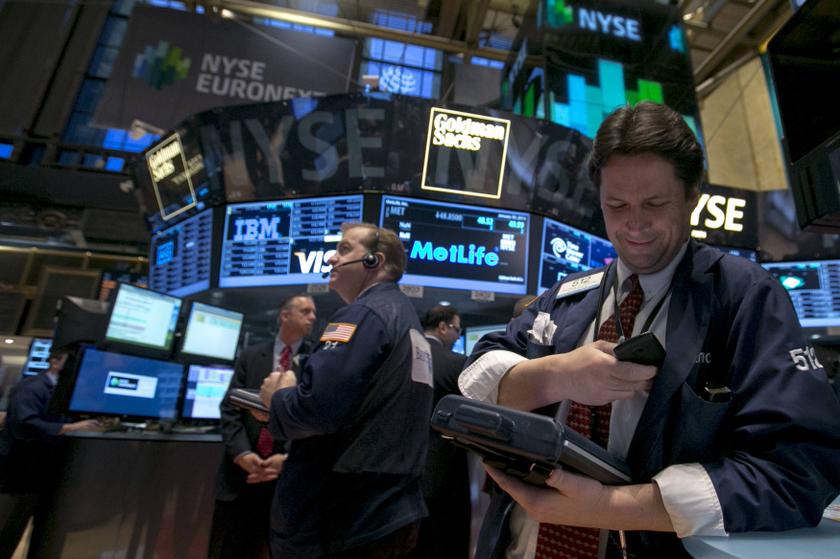 Trader Patrick McKeon (right) works on the floor of the New York Stock Exchange January 30, 2014. u00e2u20acu201d Reuters pic