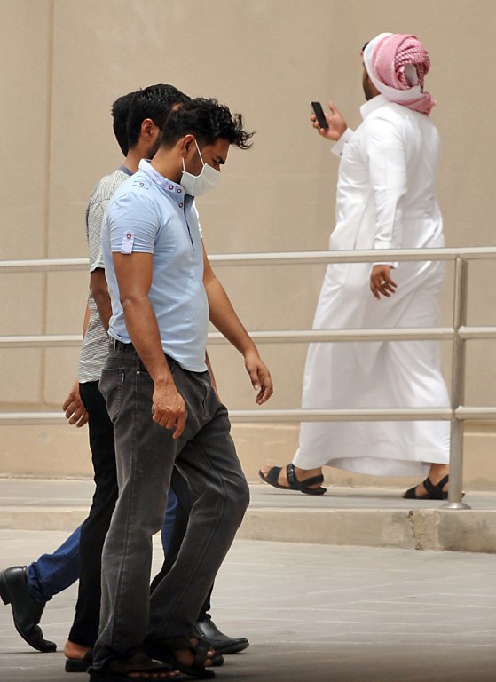 Saudis and foreigners walk inside the compound of the King Fahad hospital in the city of Hofuf, some 370 kilometres East of the capital Riyadh, on June 16, 2013. u00e2u20acu201d AFP pic