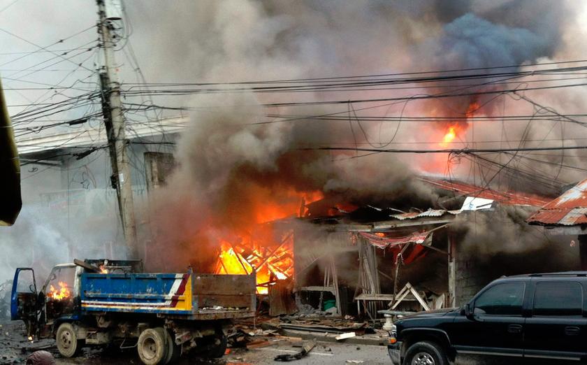 Houses are engulfed in fire after a bomb attack in the centre of Cotabato city in southern Philippines, August 5, 2013. u00e2u20acu201d Reuters pic