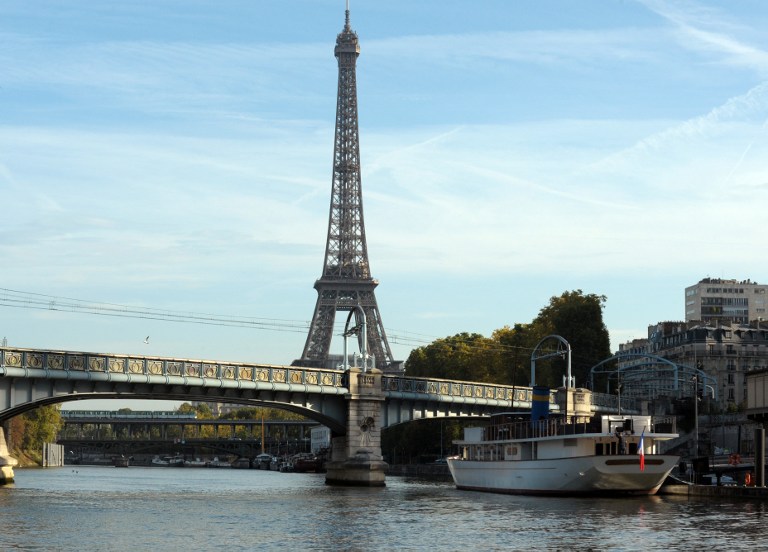 A picture taken on October 22, 2013 from behind a window on boat shows the Eiffel Tower in Paris. u00e2u20acu201d AFP pic