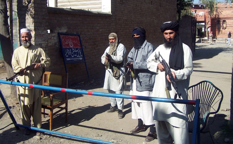 Armed Pakistani militants loyal to Mullah Fazlullah stand at a police station at Matta in Swat district, 06 November 2007. Fazlullah was elected Pakistan Taliban's new leader today. u00e2u20acu201d AFP pic