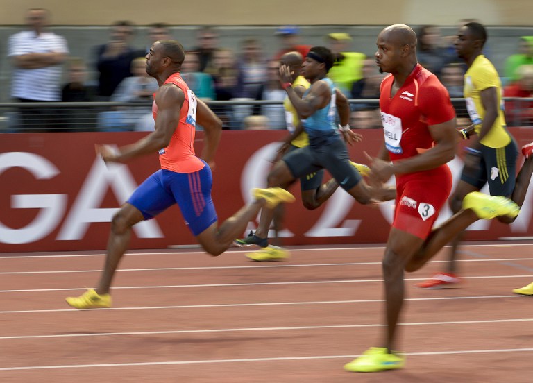 US athlete Tyson Gay (left) competes ahead of Jamaica's Asafa Powell (right) 100m event at the Diamond League Athletics meeting ,Athletissima, on July, 4, 2013 in Lausanne. u00e2u20acu201d AFP pic