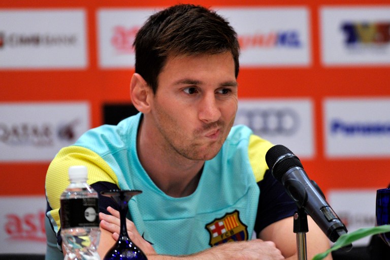 Barcelona football player Lionel Messi reacts during a press conference at a hotel in Kuala Lumpur on August 8, 2013. u00e2u20acu201d AFP pic
