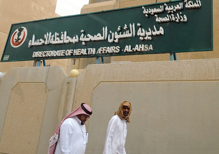 Saudi men walk to the King Fahad hospital in the city of Hofuf, some 370 kilometres East of the capital Riyadh, on June 16, 2013. u00e2u20acu201d AFP pic