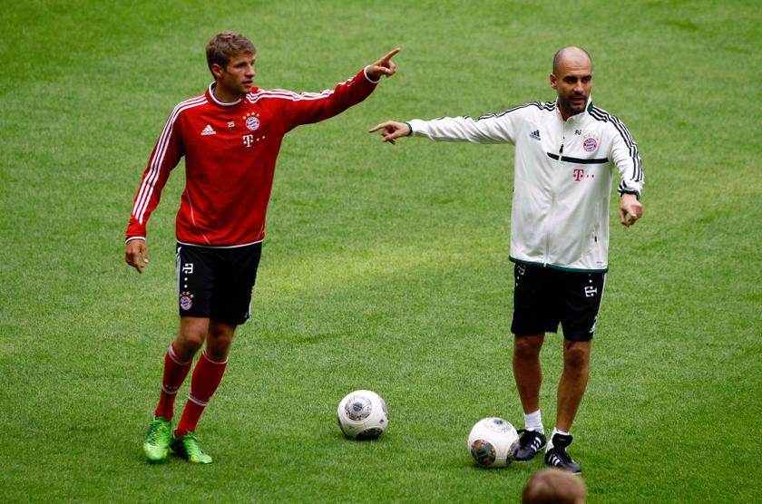 Bayern Munich new head soccer coach Pep Guardiola (right) points to player Thomas Mueller during his first team training session, at the Allianz Arena in Munich June 26, 2013. u00e2u20acu201d Reuters pic