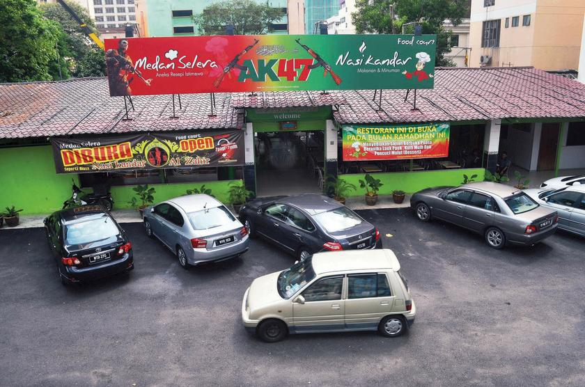 Kuala Lumpur City Hall has instructed the AK-47 Nasi Kandar Restaurant to remove the offending signboard. u00e2u20acu201d The Malay Mail pic