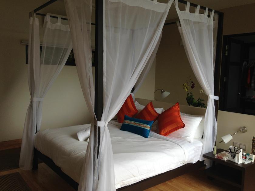 A proper four-poster bed in Ambong Ambong for the weary traveller.