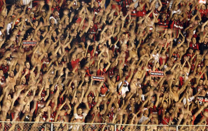 Fans of Brazilu00e2u20acu2122s Atletico Paranaense cheer for their team before they play Peruu00e2u20acu2122s Sporting Cristal in their Copa Libertadores match in Curitiba, February 5, 2014. u00e2u20acu201d Reuters pic