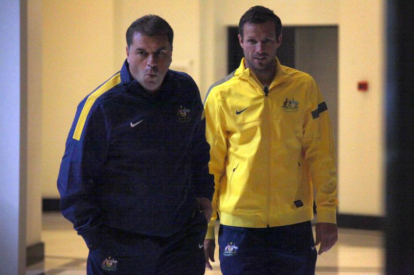 Captain of the Australian football team Lucas Neill (right) walks with new team coach Ange Postecoglou to a media conference in Sydney November 18, 2013. u00e2u20acu201d Reuters pic