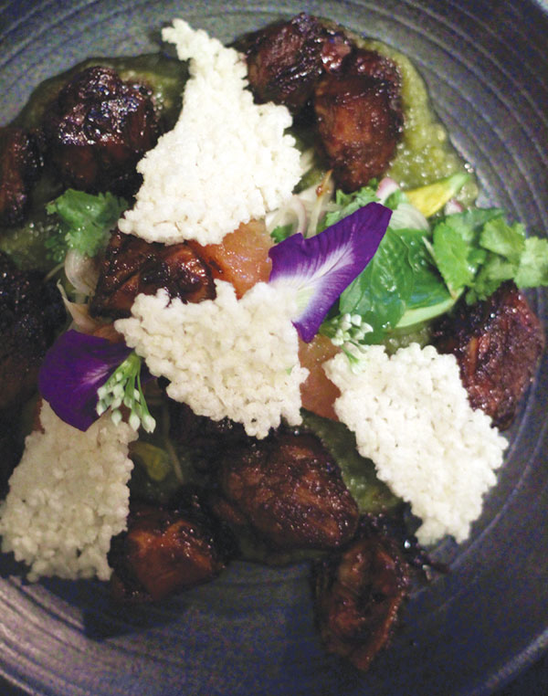 Organic pork poached in master stock with avocado, red grapefruit, toasted sticky rice and local Thai flowers - a delight for the senses