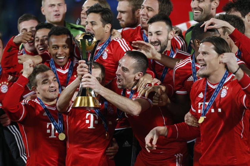 Germany’s Bayern Munich Franck Ribery (second right) and Philipp Lahm hold the trophy as they celebrate with their team mates after winning their 2013 FIFA Club World Cup final match against Morocco’s Raja Casablanca in Marrakech.