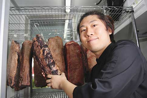 Chef JK shows how dry-aged beef is stored.