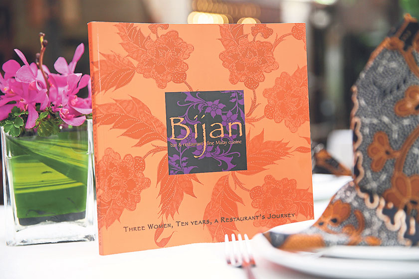 The cookbook is distinctly Bijan with its signature colours and batik print