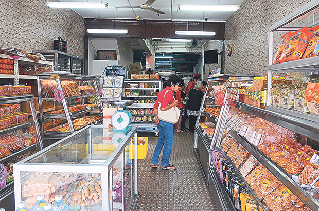 Ng Kee Cake Shop along Cintra Street still sells traditional biscuits made the traditional way