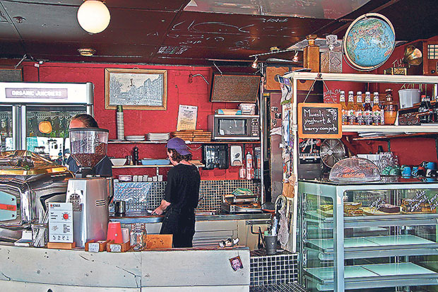 The signature red wall behind the Memphis Belle bar