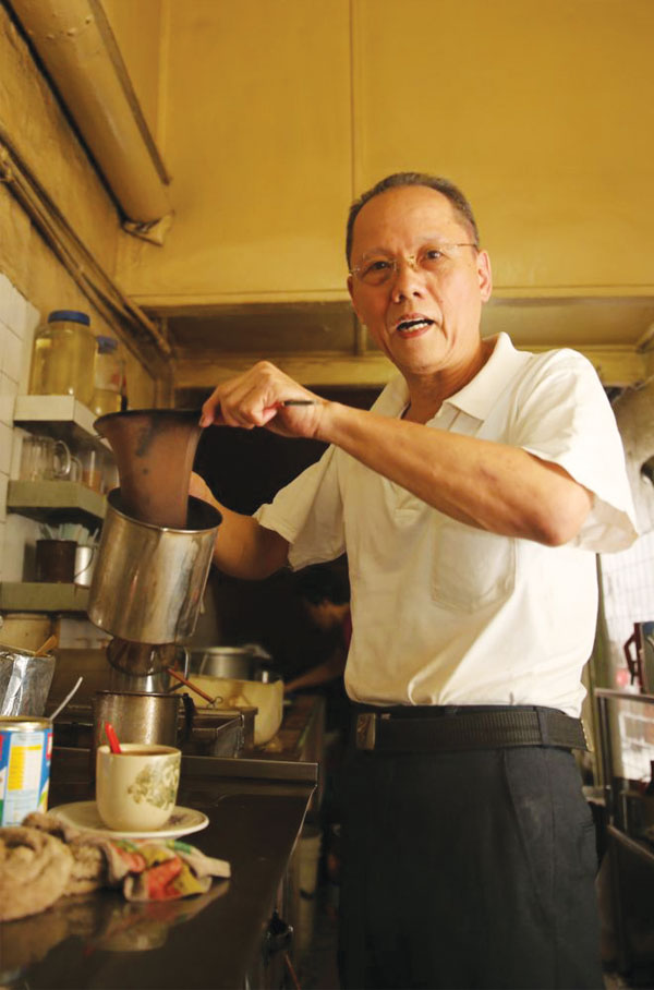 Lin Kee Hua makes coffee for customers