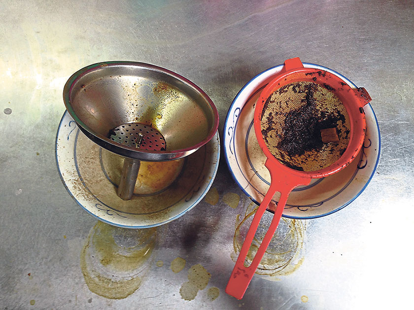 The tea is strained before being kept in thermal flasks