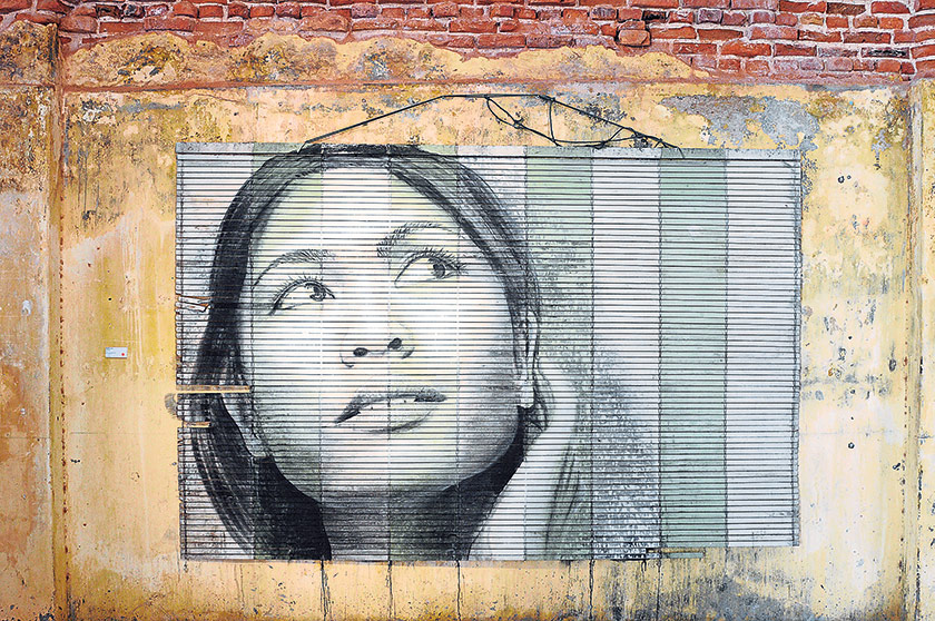 A portrait on bamboo blinds by Rone at Hin Bus Depot Art Centre for Urban Exchange