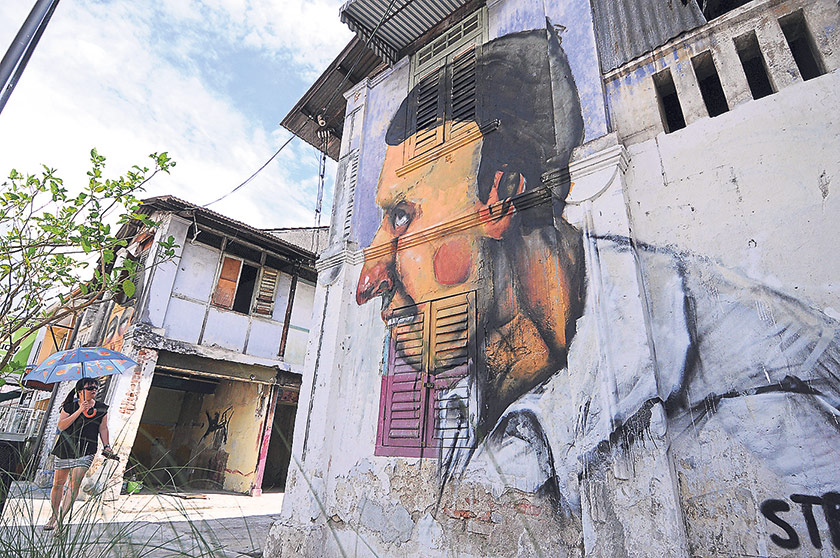 Mural by Antanas Dubra on the walls of vacant buildings along Nagore Road