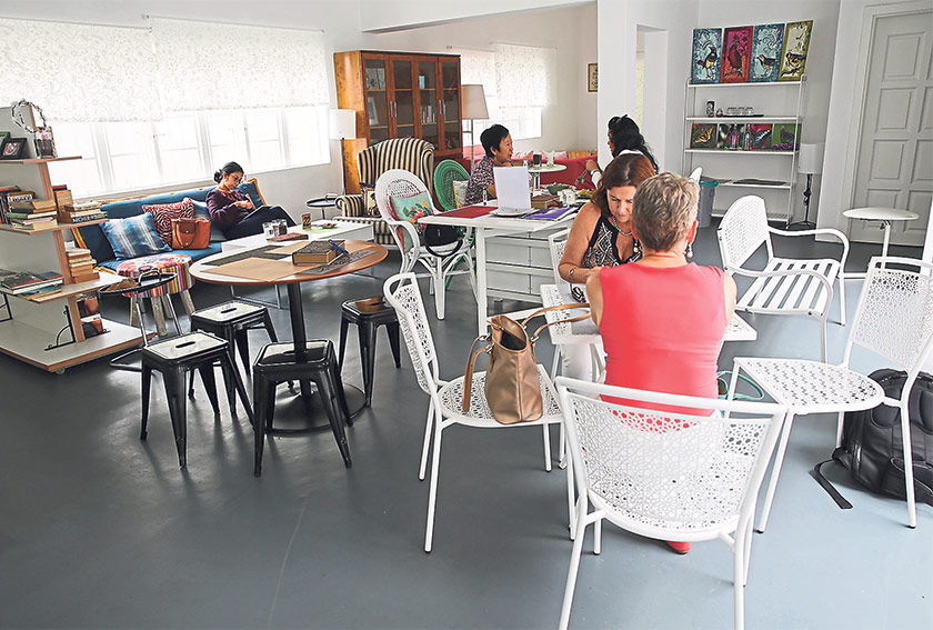 The furniture is a nice mix of styles, from dining tables to comfortable sofas for people to chill out