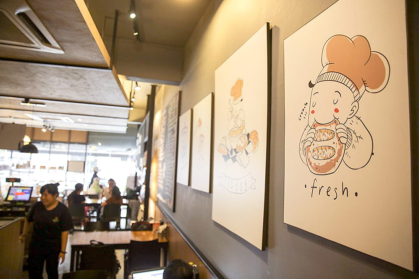The distinctive warm colours and whimsical illustrations of Tedboy Bakery