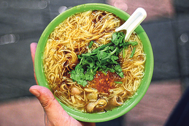 Oyster vermicelli with salt-cured pig’s intestines, shredded bamboo shoots, bonito flakes, fresh cilantro, spicy chilli oil, puréed garlic and vinegar.