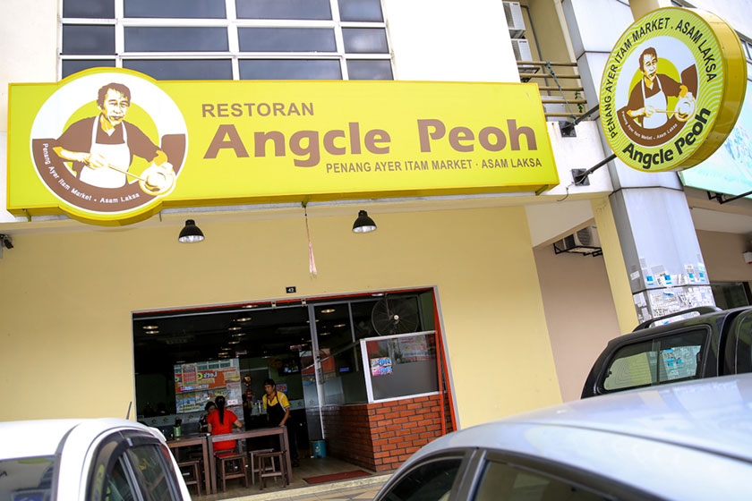 The origin of the asam laksa is told on the walls of the restaurant