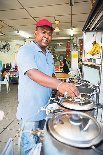 Divagaran Ganasan mans the stall when his wife is not free to run the place