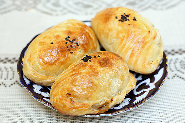 Pick up samsa where flaky pastry is filled with minced beef, mutton, chopped onions and flavoured with cumin.