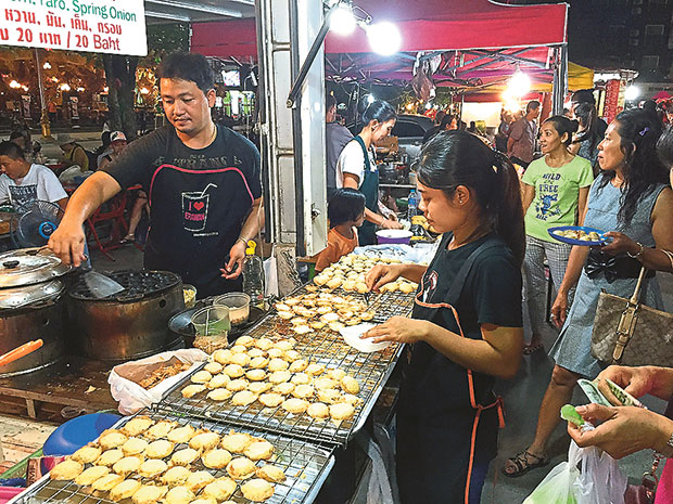 There are many stalls at the night market selling all sorts of local delicacies such as these mini pancakes.