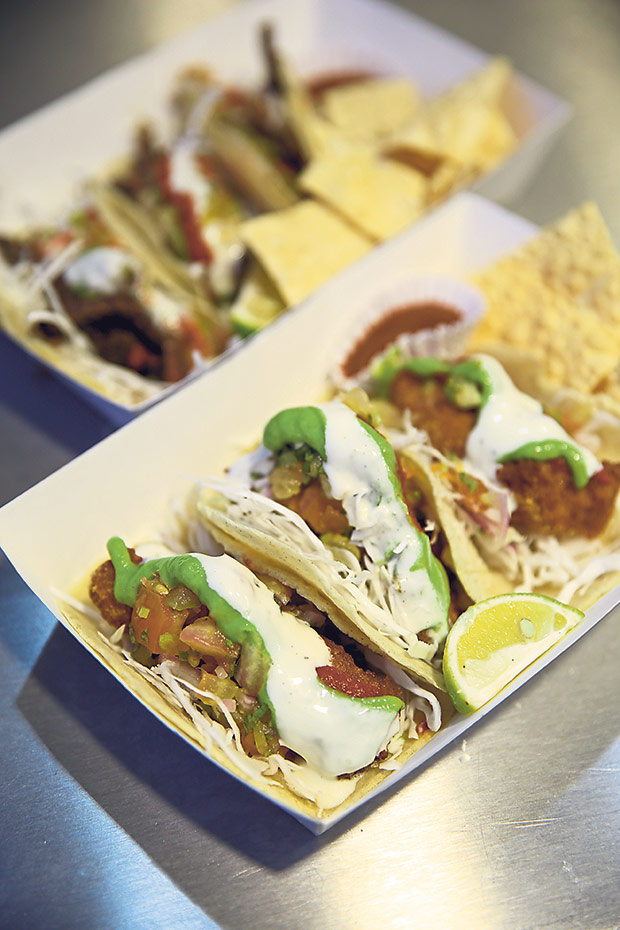 Fish tacos ensenadas with corn tortillas is served with pappadums